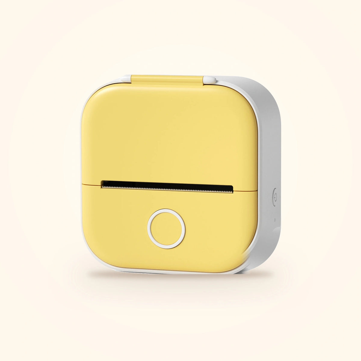 Mini imprimante à stickers du coffret Stickou, coloris jaune, posée sur fond crème
