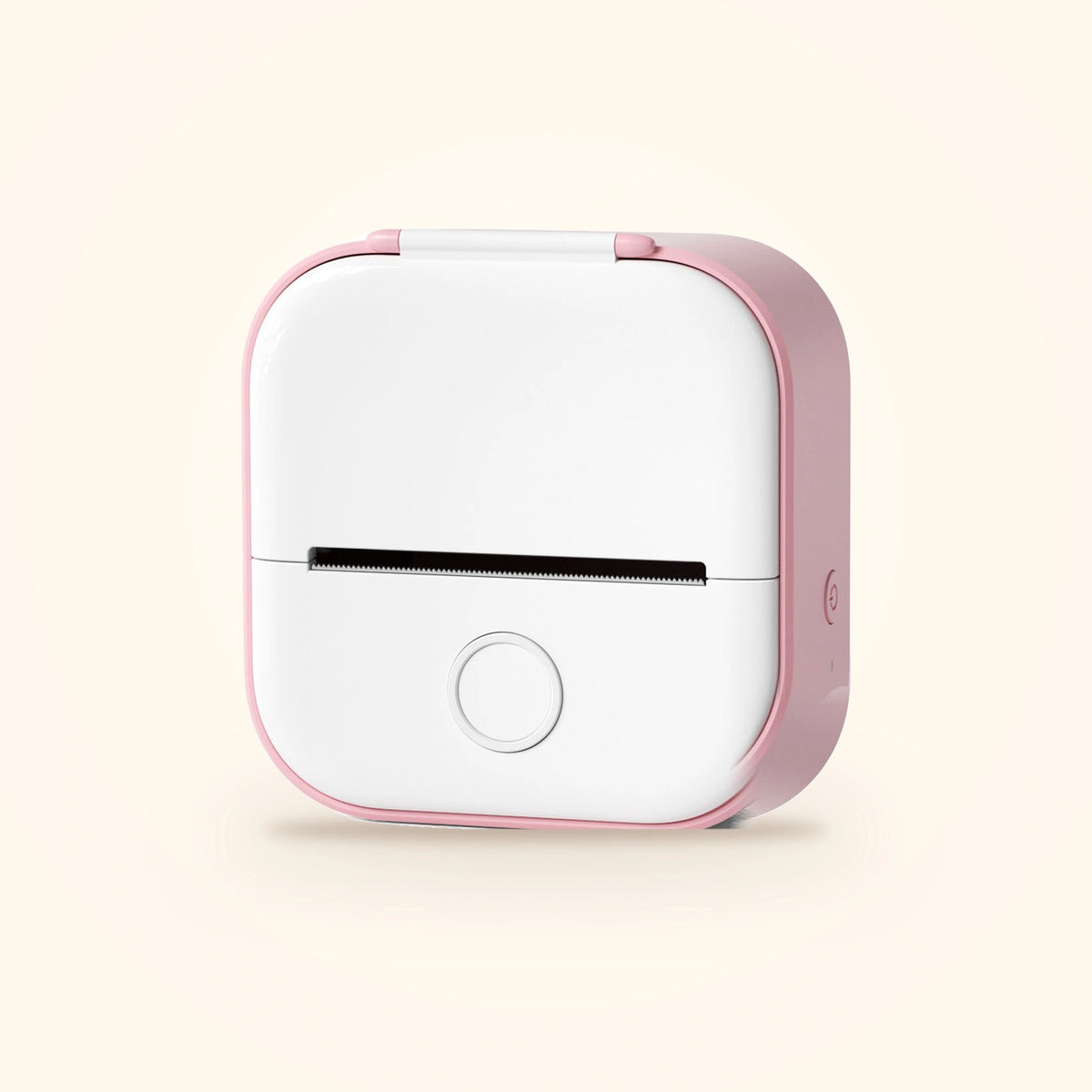 Mini imprimante à stickers du coffret Stickou, coloris rose façade blanche, posée sur fond crème